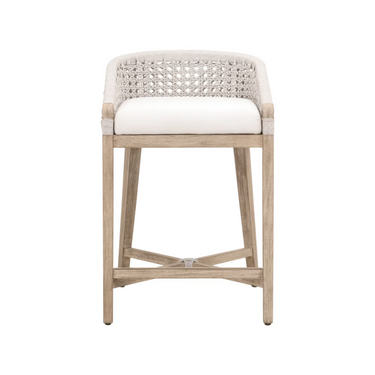Counter stool with woven backrest and white cushion on a white background
